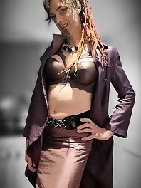 A girl in black underwear plays with a blue item that matches her dress