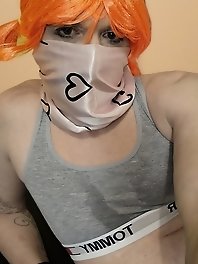 A chick in snow white underwear is having fun with a guy in his car