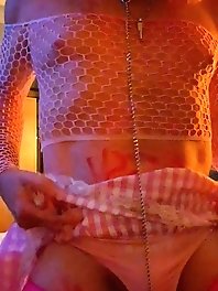 A nice girl in a sexy dress plays a little sissy